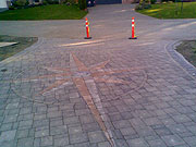 Stone pavers driveway with compass pattern
